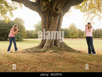 Kids with Tin Can Phones Stock Photo