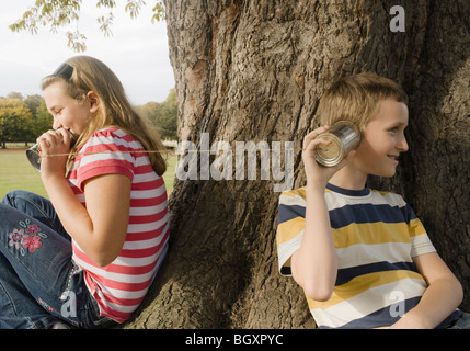 Kids with Tin Can Phones Stock Photo