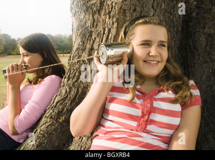 Kids with Tin Can Phones Stock Photo