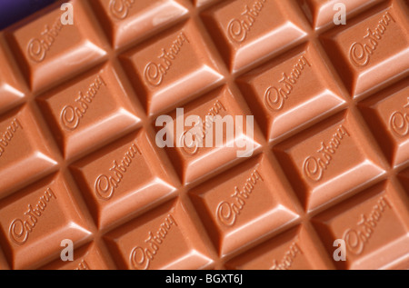 A bar of Cadbury's milk chocolate, featuring the Cadbury's logo. Stock Photo
