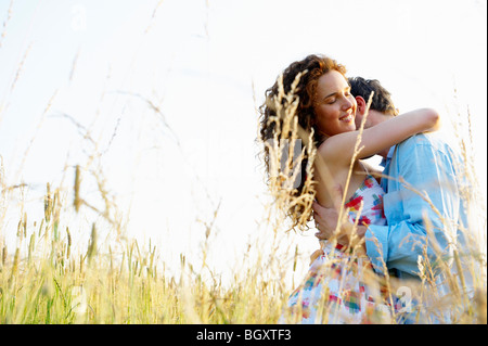 Couple kissing in a wheat field Stock Photo