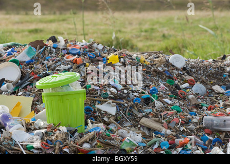 Full garbage can in midst of landfill Stock Photo - Alamy