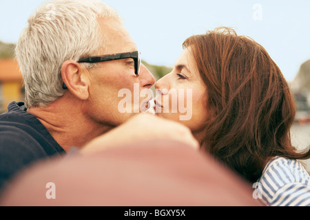Middle aged couple on an old boat Stock Photo