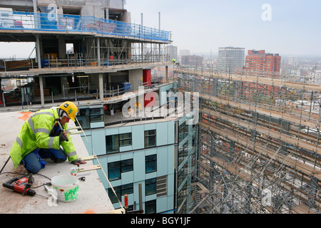 Construction worker working on the cube building in Birmingham. Stock Photo
