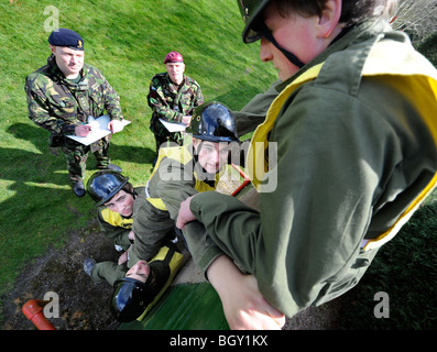 Sixteen year old boys tackle the wall during physical problem solving exercises at The Army Officer Selection Board in Westbury, Stock Photo