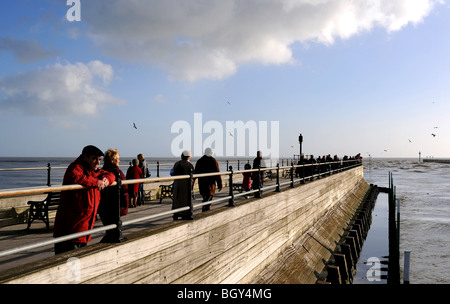 People on the harbour arm at Littlehampton harbour West Sussex UK Stock Photo