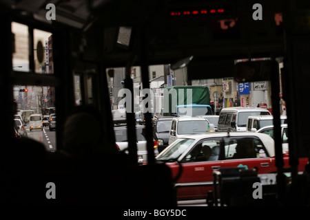 Traffic in Shijo Dori (Shijo street), seen from inside one of the numerous buses which serve the city centre, in central Kyoto. Stock Photo