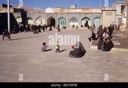 Children playing in the sun in front of the Imam Zadeh Sayd Shah Shiragh shrine, Shiraz, Iran 690126 111 Stock Photo