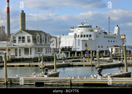 Car and passenger ferry approaches Port Jefferson Harbor after crossing Long Island Sound from Bridgeport, CT Stock Photo