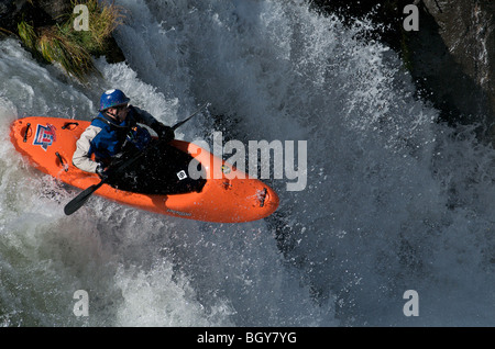 A kayaker drops Steelhead Falls on the Deschutes River. Stock Photo