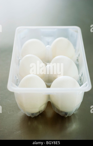 Fresh eggs in carton Stock Photo