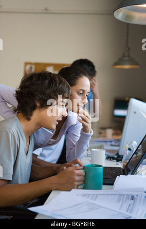 College students collaborating on project Stock Photo