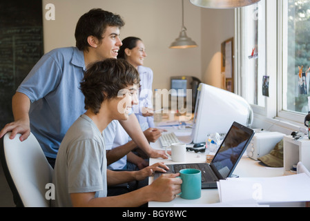 College students collaborating on project Stock Photo