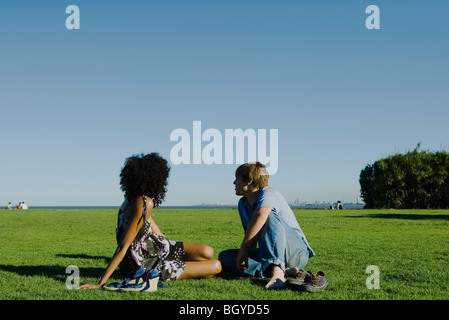 Young couple relaxing together in park Stock Photo