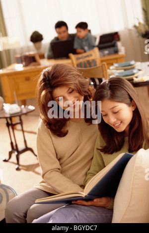 Family reading together Stock Photo