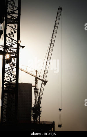 Cranes and high-rise building under construction Stock Photo