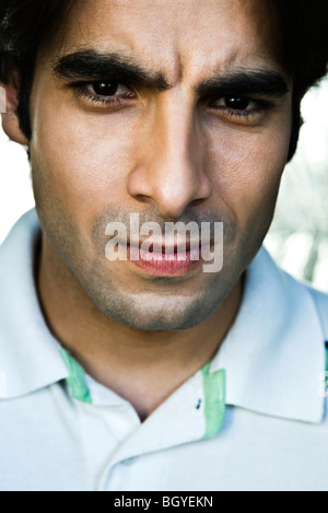 Man furrowing brow, portrait Stock Photo