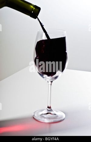 Food concept, pouring imitation wine into wine glass Stock Photo