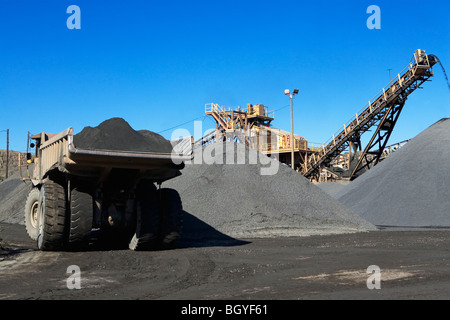 Truck and gravel piles Stock Photo