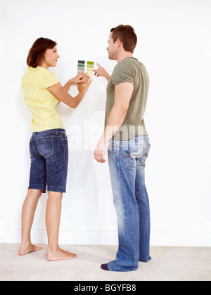 Couple looking at colour samples Stock Photo