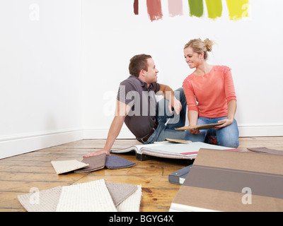 Couple looking at carpet samples. Stock Photo
