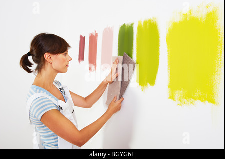 Woman looking at carpet samples. Stock Photo