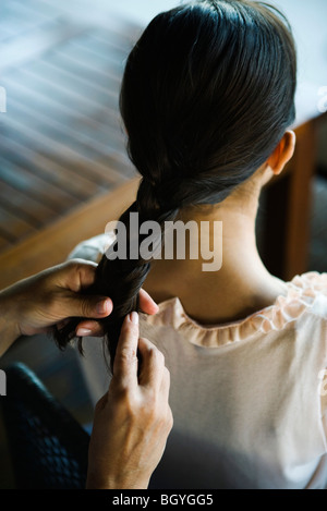 Braiding hair Stock Photo
