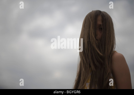 Female with face obscured by long hair Stock Photo