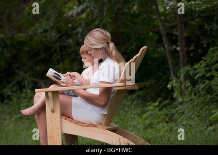 Woman reading to son Stock Photo