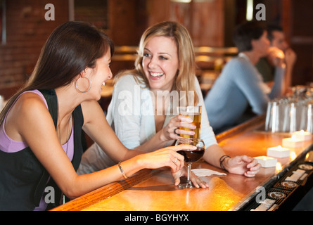 Friends drinking at bar Stock Photo