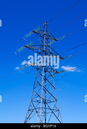 Electricity pylon with blue sky and small white clouds behind Stock ...