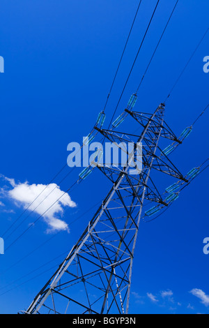Electricity pylon with blue sky and small white clouds behind Stock ...