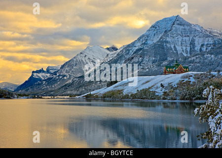 Prince of Wales Hotel overlooking Middle Waterton Lake after the first snowfall of winter, Waterton Lakes National Park (a UNESC Stock Photo