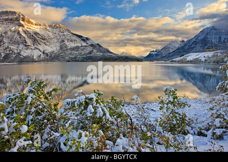 Prince of Wales Hotel opposite Mt Vimy and overlooking Middle Waterton Lake after the first snowfall of winter, Waterton Lakes N Stock Photo