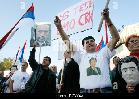 A Bosnian Serb shows a mask featuring the face of Bosnian Serb wartime leader Radovan Karadzic during a protest Stock Photo