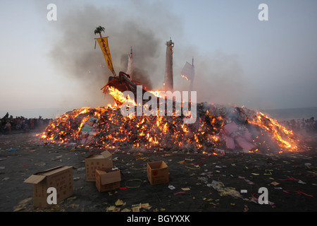 wood boat burning for a taiwanese festival Stock Photo