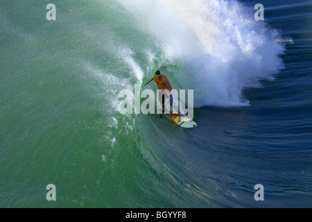 Surfer in the tube of large wave Stock Photo