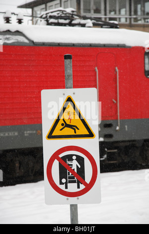 high voltage power sign; warning of climbing on trains Stock Photo