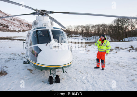 The North West Air Ambulance scrambled to evacuate an injured walker in Langdale, Lake District, UK. Stock Photo