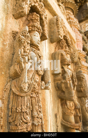 Female figures are sculpted onto a wall of the Chennakeshava Temple at Belur in Karnataka, India. Stock Photo