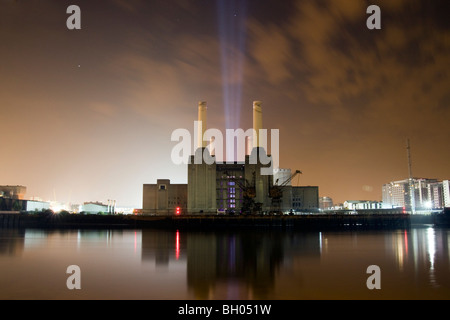 Battersea power station at night with light beams Stock Photo