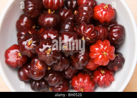 A bowl of pitangas or Surinam Cherries, the fruit from the Eugenia uniflora tree, Stock Photo