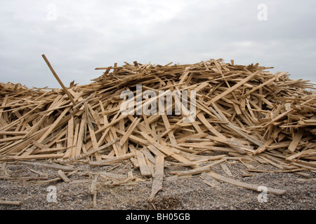 Timber Ship Stack Stacks of timber washed up on Worthing beach after ship wreck Stock ...