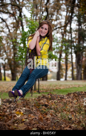 Attractive teenage girl on a rope swing Stock Photo