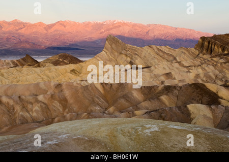 sunrise glow on Panamint Range, Zabriskie Point, Death Valley National Park Stock Photo