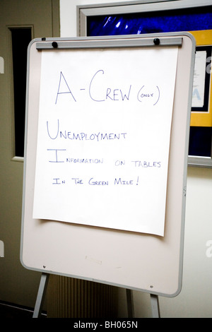 A sign announcing the availability of unemployment information greets exiting employees at an auto plant in Dearborn, MI. Stock Photo