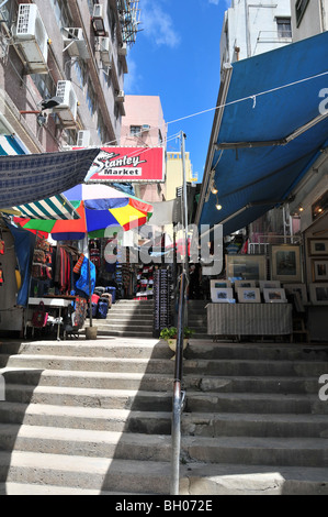 Ladder alleyway, with artwork and clothes shops, Stanley Market, Stanley (Chek Chue), Hong Kong, China Stock Photo