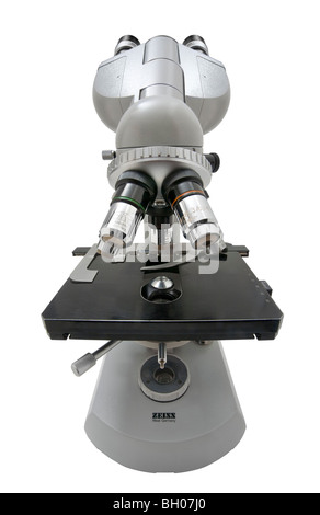Front distorted view of a Zeiss standard compound microscope white background Stock Photo