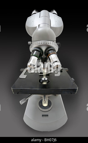 Front distorted view of a Zeiss standard compound microscope with the light path displayed from field iris to objective Stock Photo