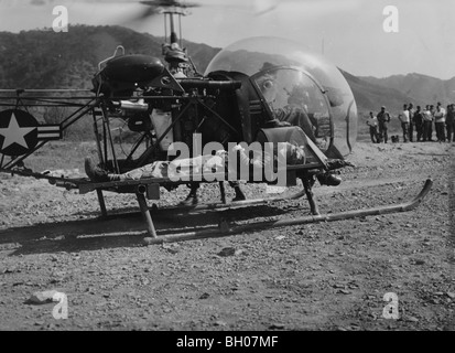 2nd Lt. Winon E. Coaley, Marine fighter pilot, who landed his F4U Corsair while wounded, is placed on a helicopter at X US Corps Stock Photo